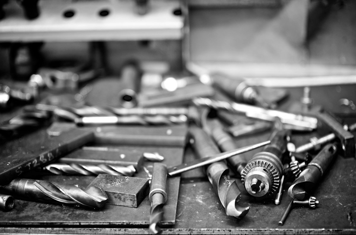 Precision tools laid out on a workshop bench
