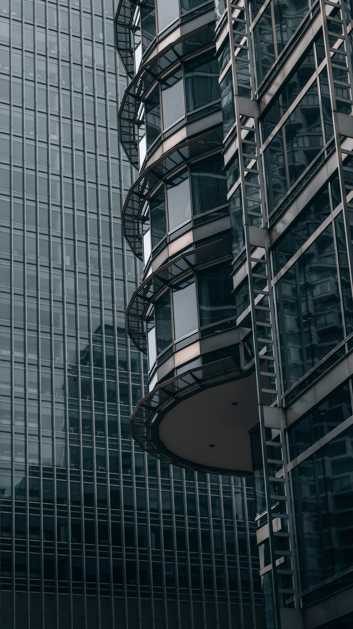 Curved balconies on a modern glass office tower in Canary Wharf, London